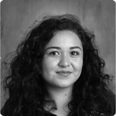 Bella Boutsisomphone-Reyes headshot in black and white. Bella Boutsisomphone-Reyes headshot in black and white.