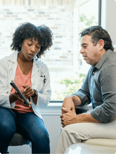 A Man talking to his doctor.